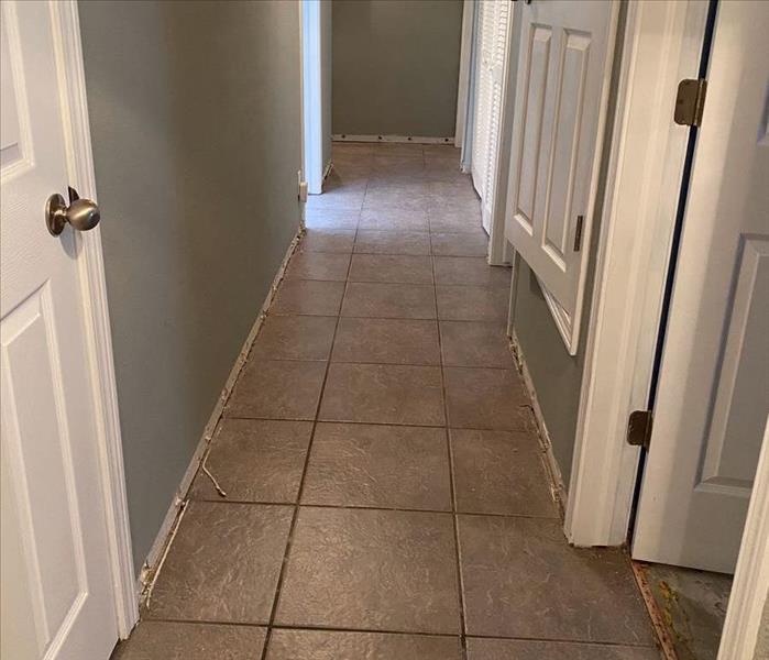 hallway in home after mitigation with molding removed