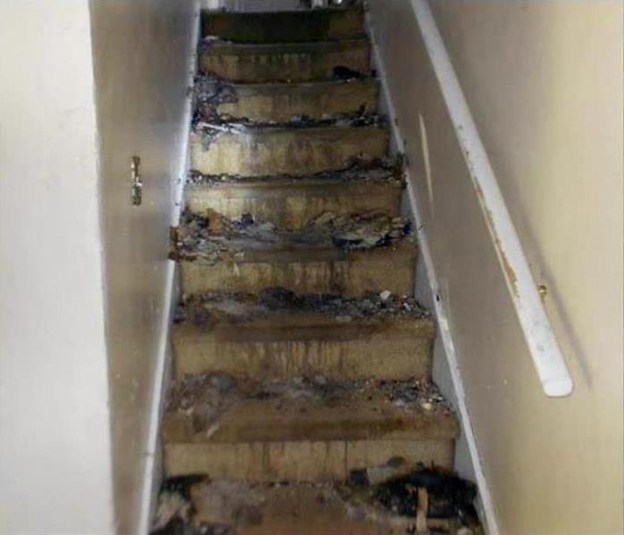 Fire damage and soot to a stair case 