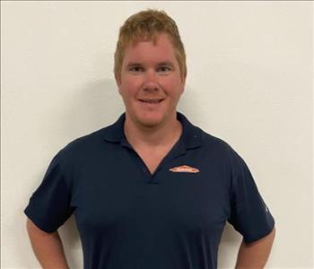 Male employee Jim is pictured on a white background.