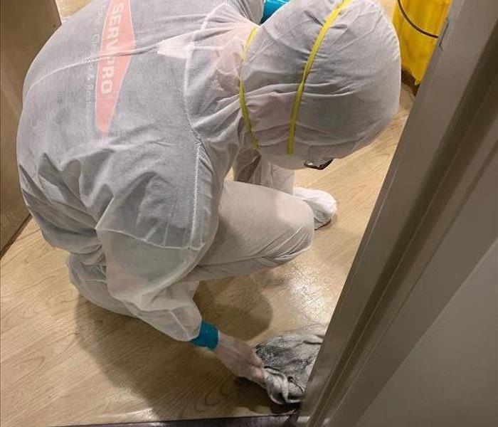 Man cleaning up after biohazard job
