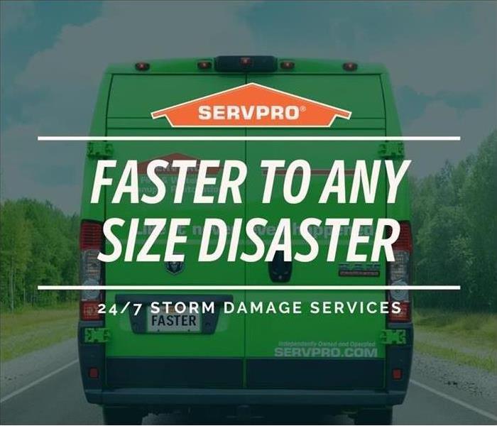 The SERVPRO Van heading to it's next job with "Faster to any Disaster" written on the back.